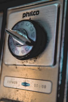 Close-up of a Philco dial with selective focus, capturing a vintage aesthetic in warm lighting.