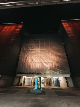 Illuminated facade of a shopping mall in São Paulo, Brazil, showcasing modern architecture.