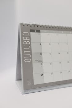 A simple and clean design of an October desk calendar with spiral binding.